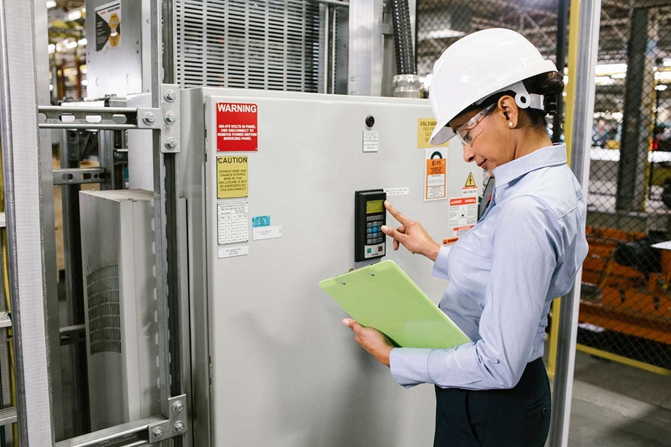 Energy manager inspecting variable frequency drive
