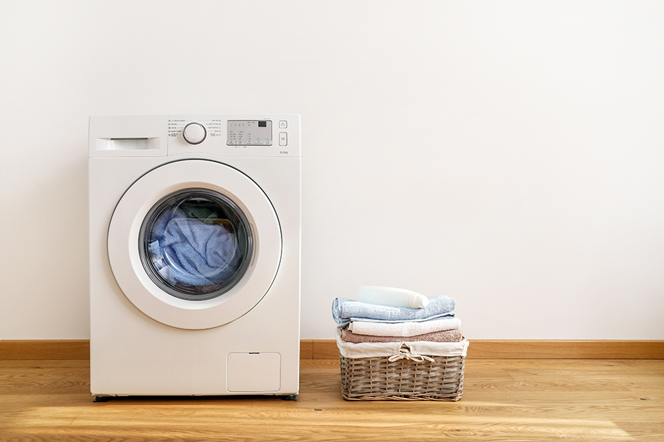 dryer and folded laundry