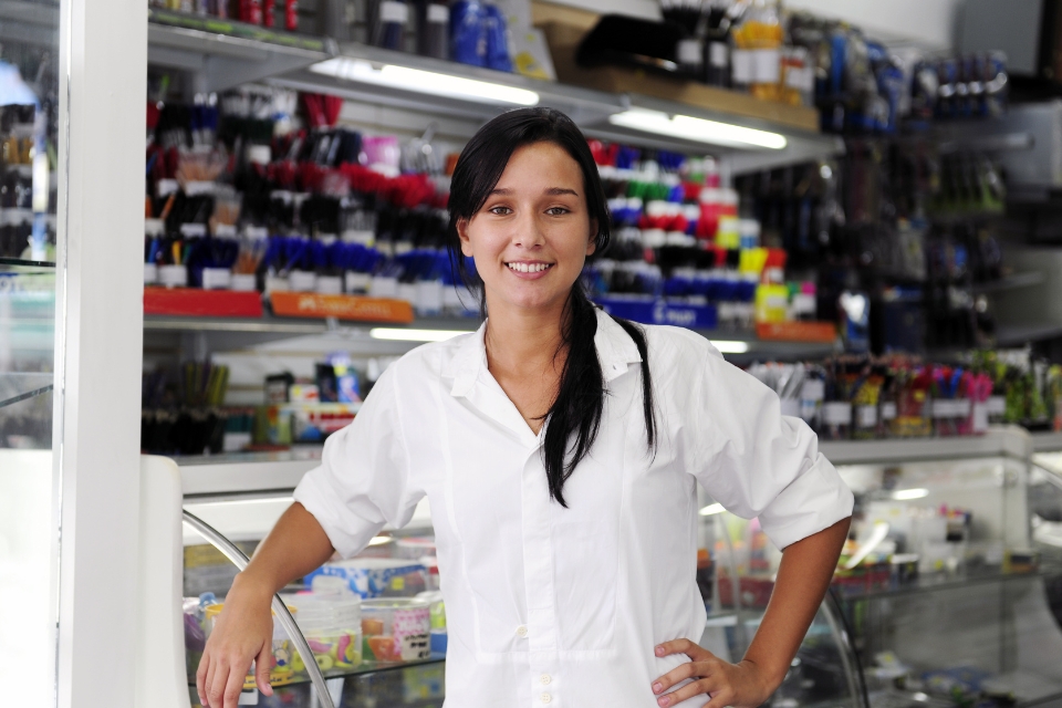 woman in front of business store counter